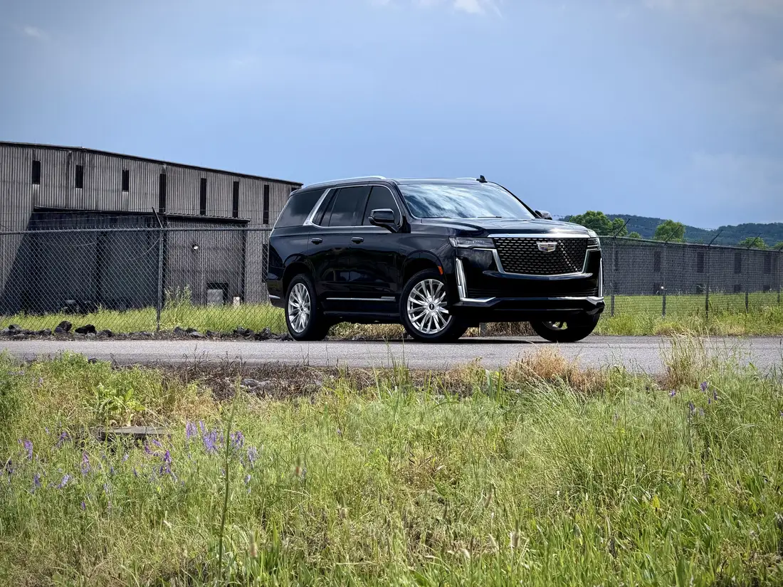 Black Cadillac Escalade chauffeur SUV on a rural road near Lynchburg, Tennessee