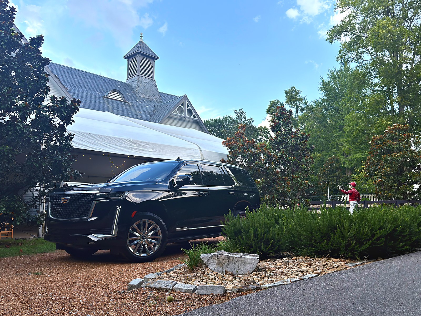 Black Cadillac Escalade arriving at the Belle Meade Winery event barn under its white tent