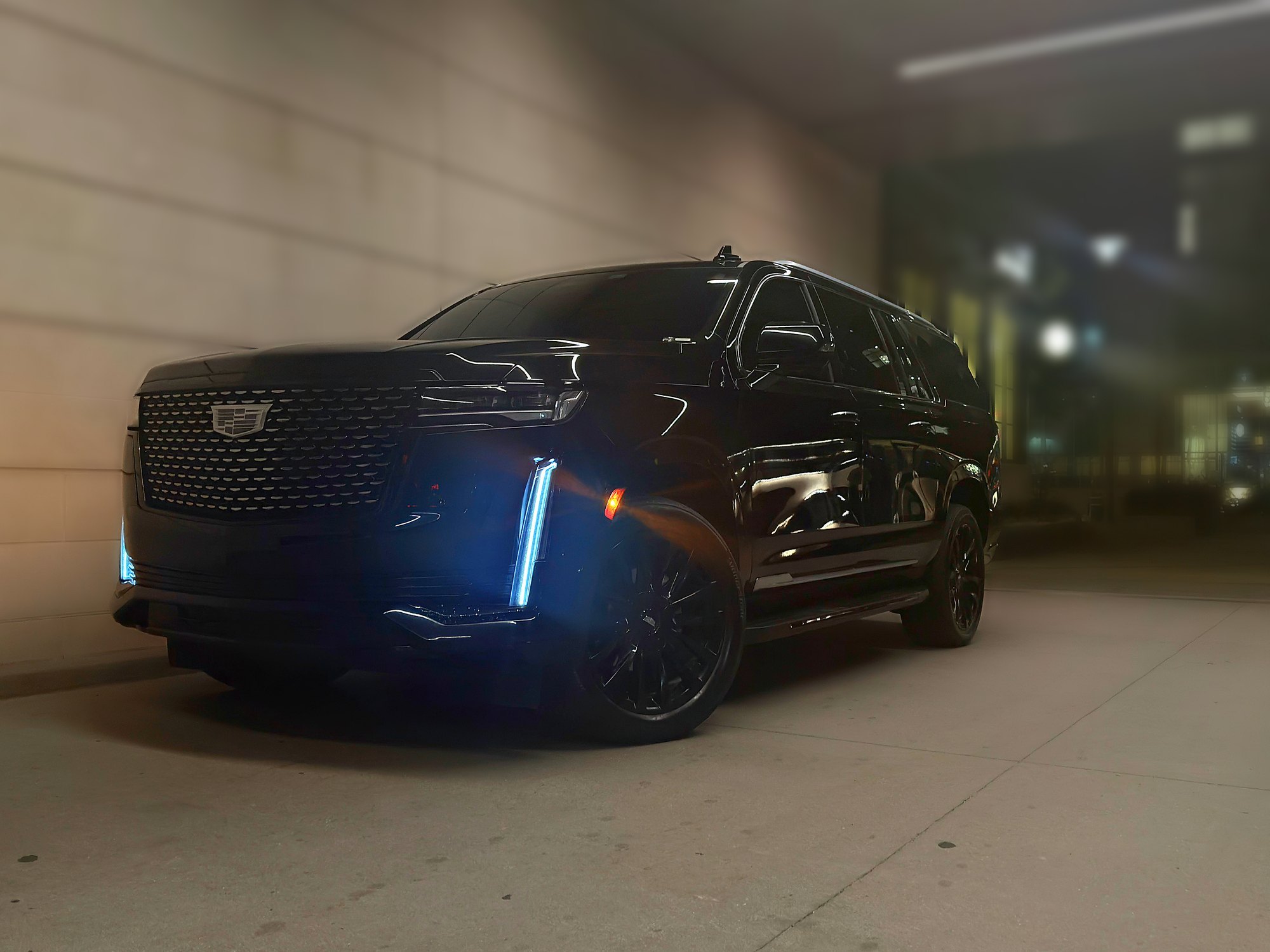 Cadillac Escalade ESV at night in Nashville — hotel entrance