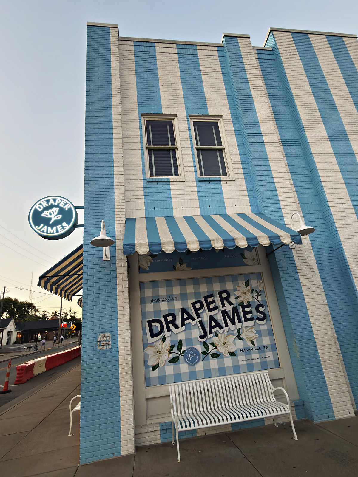 Draper James store with its blue and white striped facade and striped awning in 12 South, Nashville