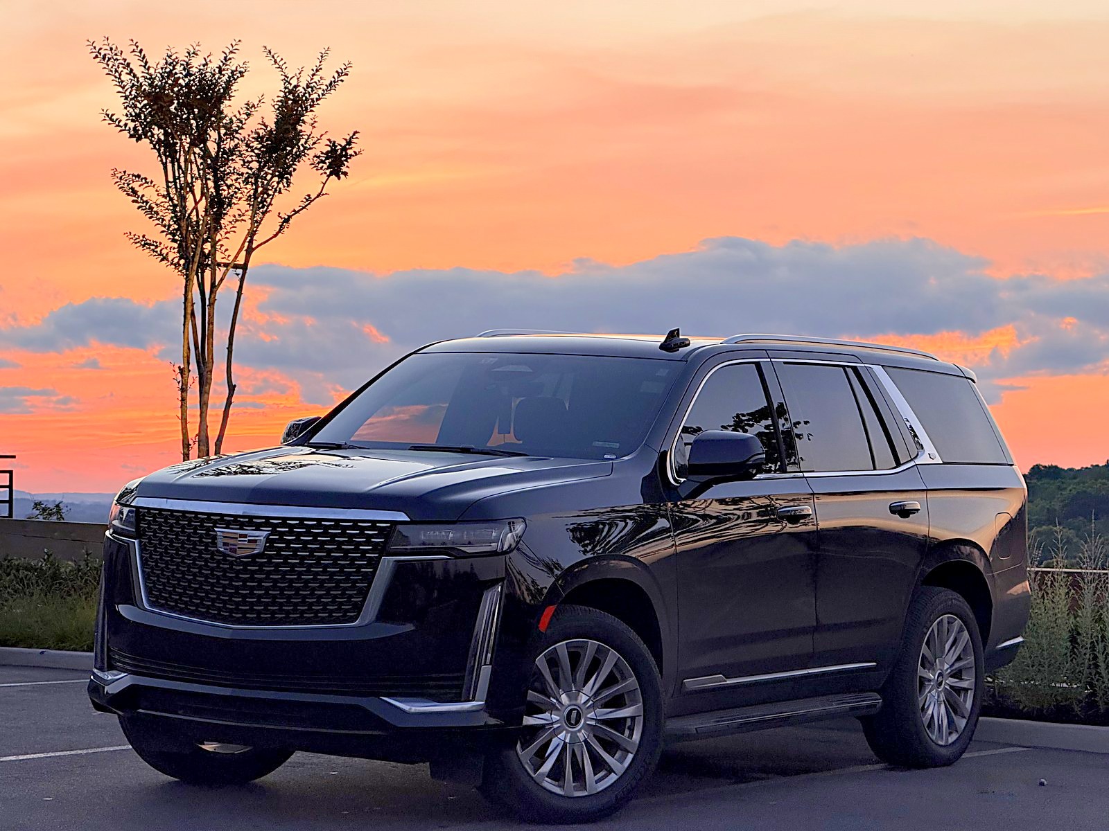 Black Cadillac Escalade at sunset near College Grove — Nashville car service