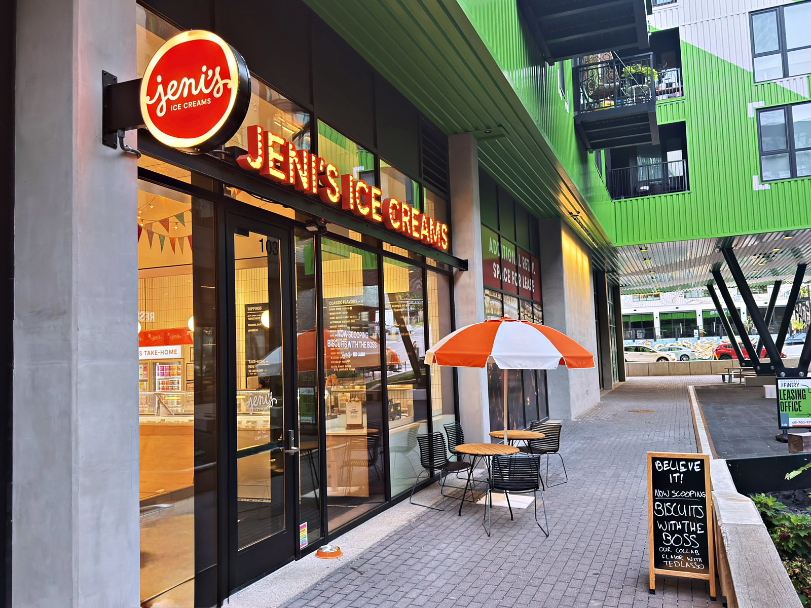 The Jeni's Ice Creams storefront with its round red sign and patio umbrella in Wedgewood-Houston, Nashville