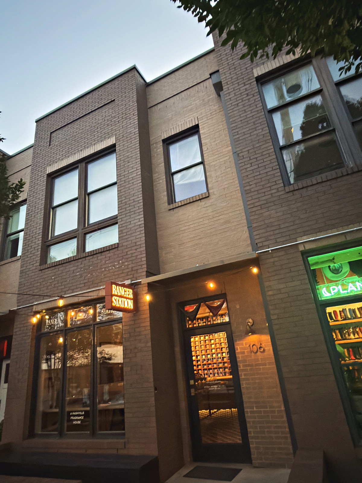 Ranger Station fragrance house storefront lit at dusk on 12th Avenue South in Nashville's 12 South neighborhood