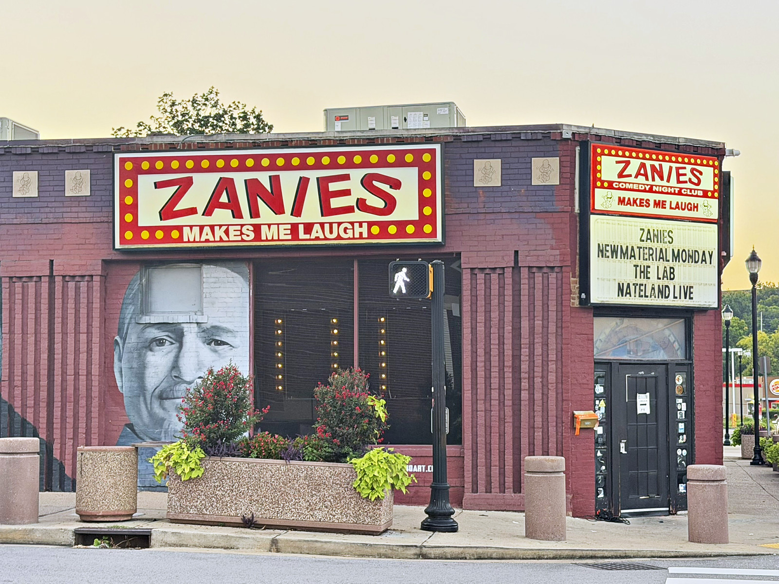 Zanies Comedy Night Club marquee and painted mural on its red brick facade on 8th Avenue South